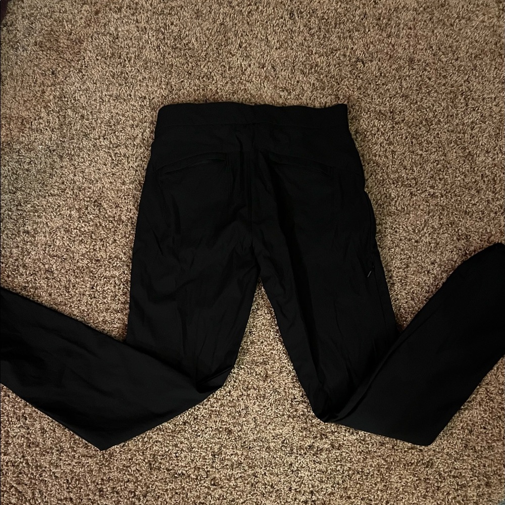 Athleta size 4 black pants. Stretchy. Pull-string cuff, pockets & side zippers. - Picture 2 of 7
